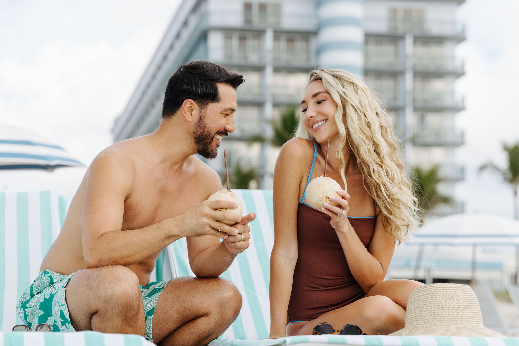 couple enjoying coconut water at the singer oceanfront resort