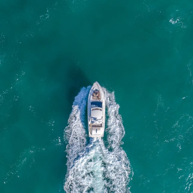 Aerial shot of a boat in the sea