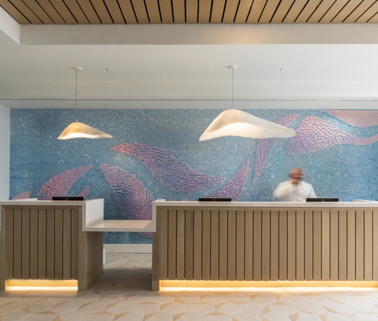 Contemporary designed front desk with coastal-inspired decor, capturing the essence of West Palm Beach living