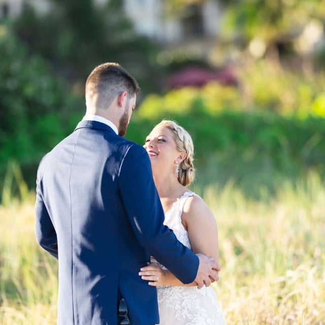 Couple getting married posing at a photo session The Singer Oceanfront Resort