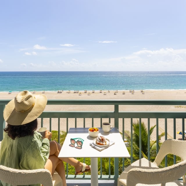 woman having coffee on the balcony