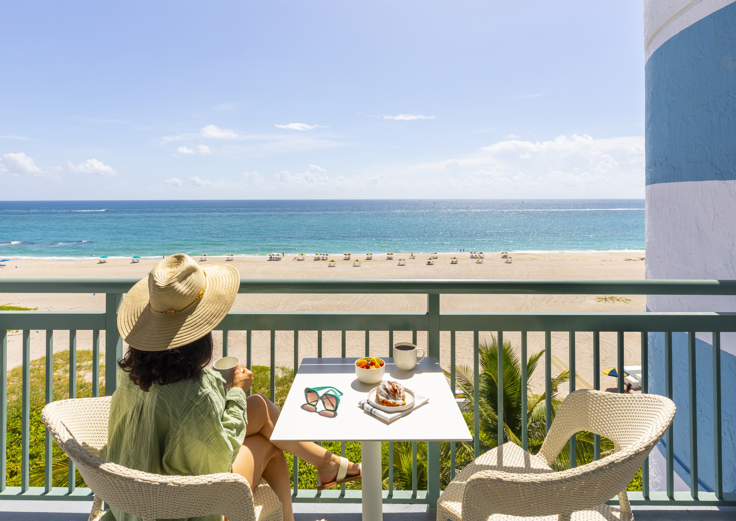 woman having coffee on the balcony